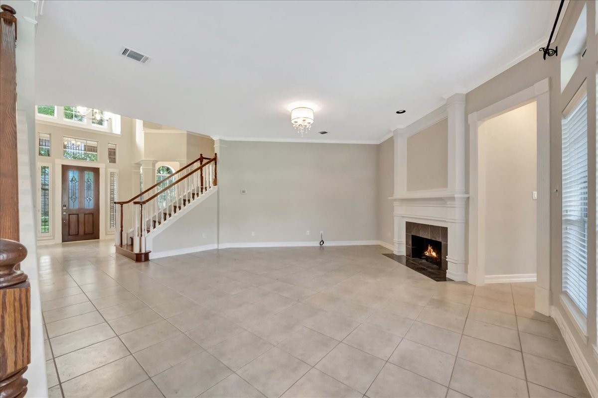 15511 Turtle Oak Court Houston, TX 77059 - Photo 27 of 50 a view of an empty room with a fireplace and a window
