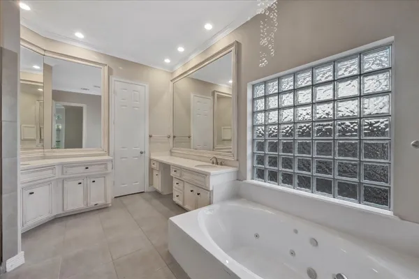 a bathroom with a granite countertop sink mirror and shower