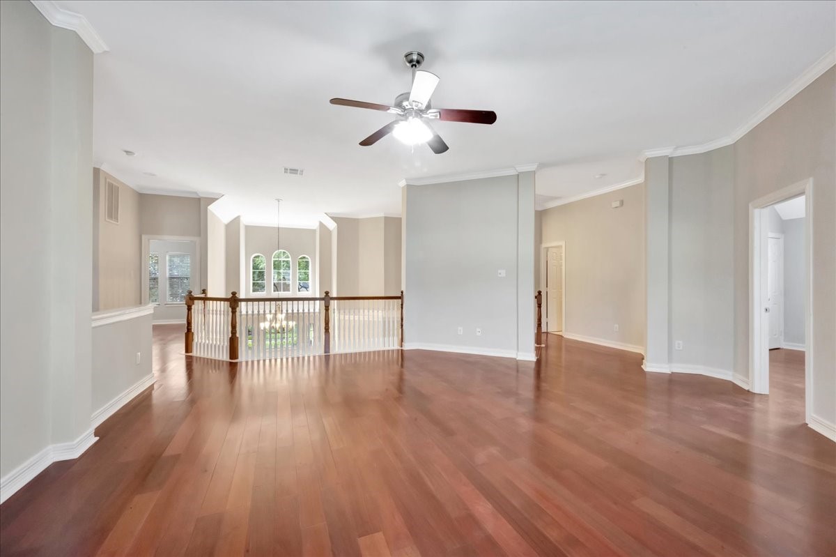 15511 Turtle Oak Court Houston, TX 77059 - Photo 39 of 50 a view of an empty room with wooden floor and a window