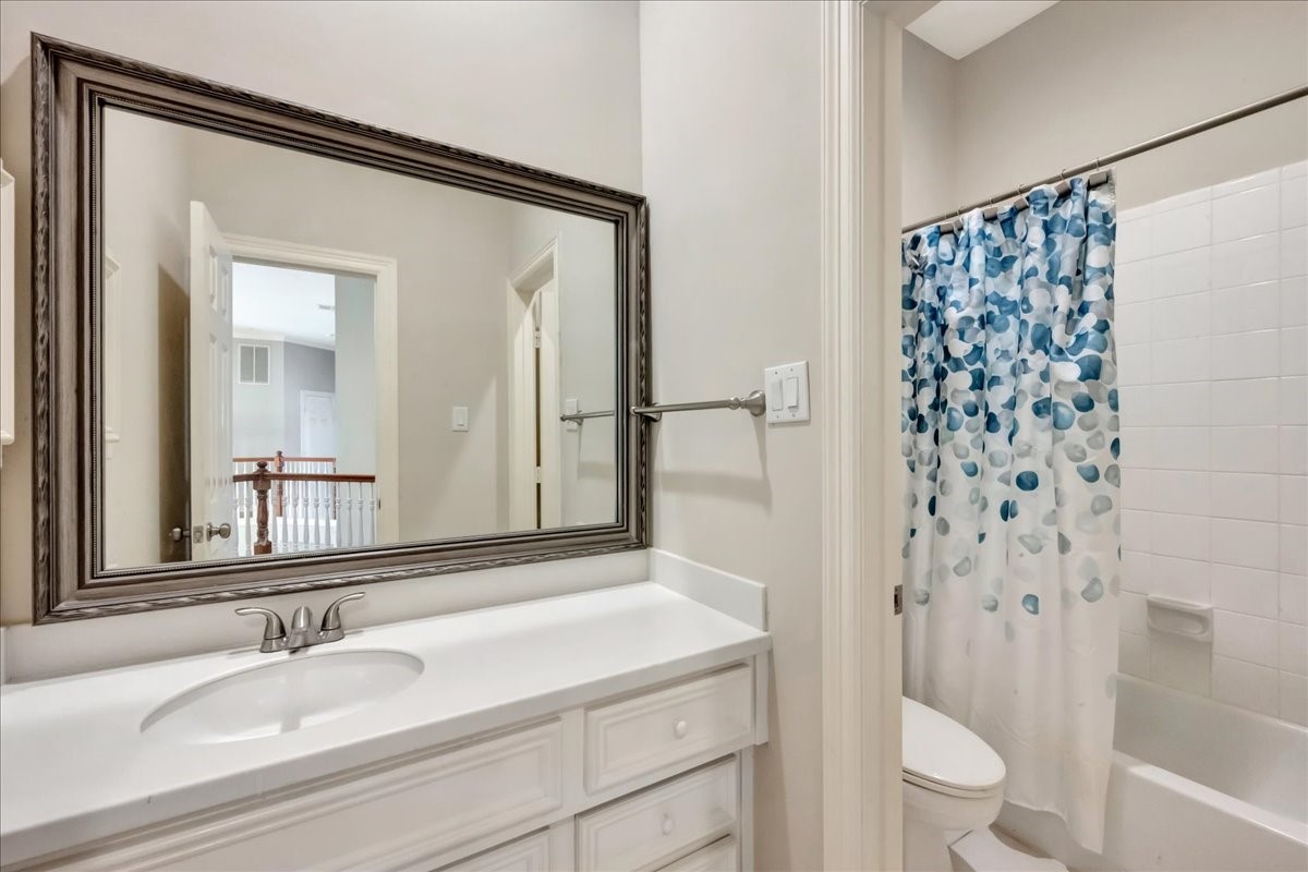 15511 Turtle Oak Court Houston, TX 77059 - Photo 41 of 50 a bathroom with a sink and a mirror