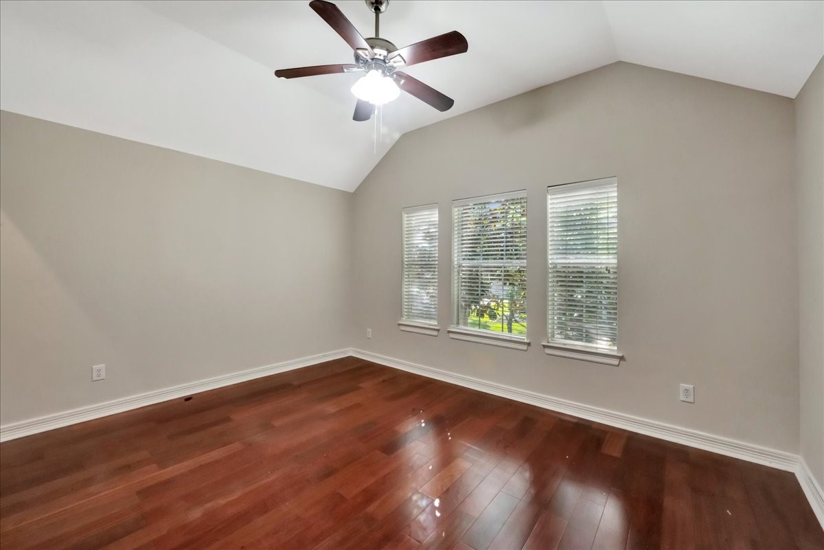 15511 Turtle Oak Court Houston, TX 77059 - Photo 45 of 50 an empty room with wooden floor and windows
