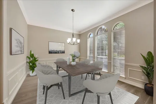 a view of a dining room with furniture window and wooden floor
