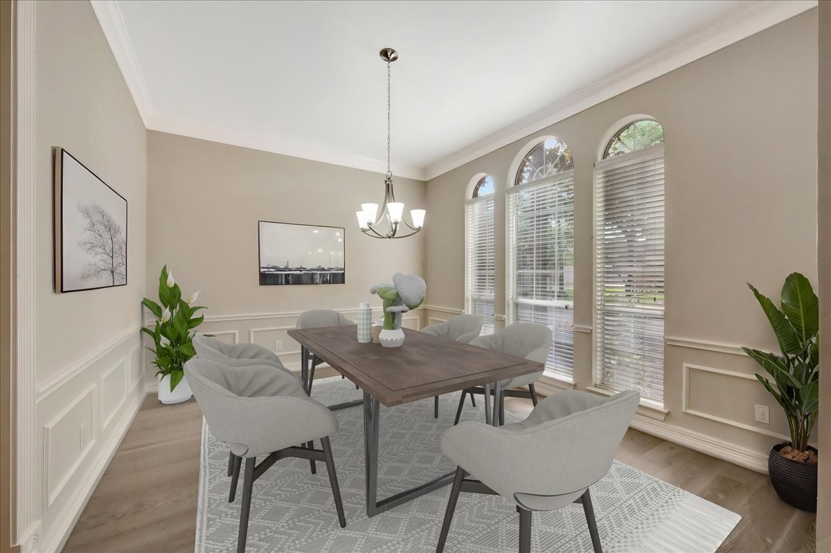 15511 Turtle Oak Court Houston, TX 77059 - Photo 6 of 50 a view of a dining room with furniture window and wooden floor