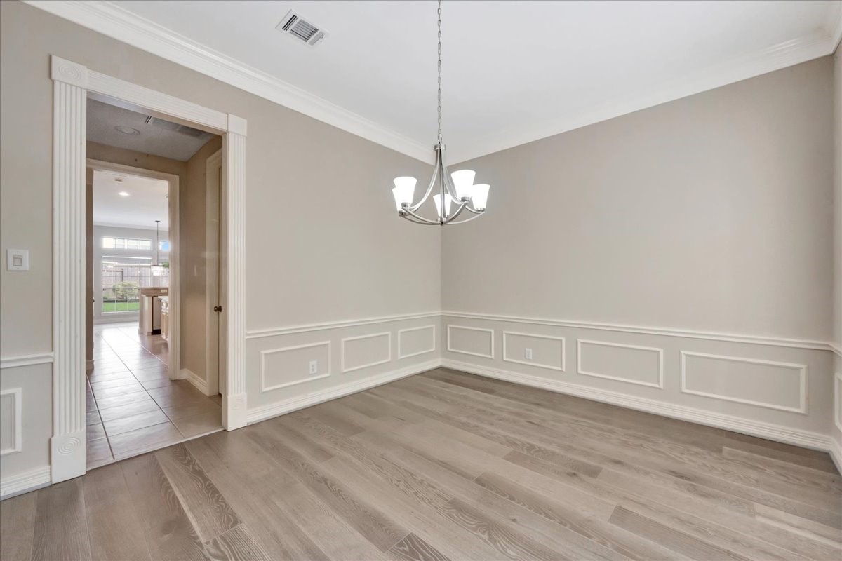 15511 Turtle Oak Court Houston, TX 77059 - Photo 8 of 50 a view of an empty room with wooden floor and a window