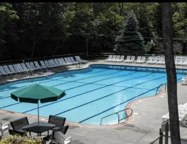 a view of a backyard with sitting area