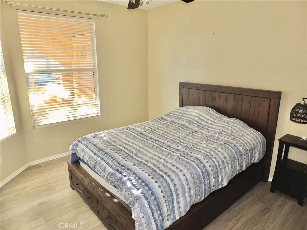19431 Rue De Valore, Unit 19B Lake Forest, CA 92610 - Photo 13 of 24 a bed sitting in a bedroom next to a window