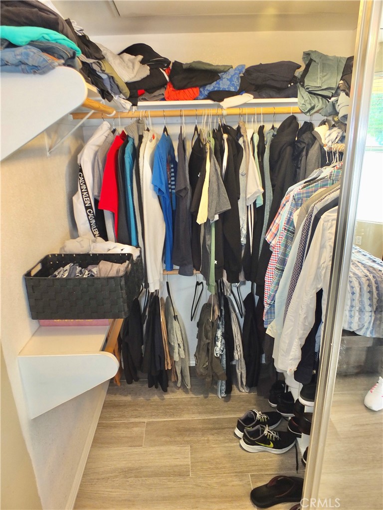 19431 Rue De Valore, Unit 19B Lake Forest, CA 92610 - Photo 14 of 24 a view of walk in closet with clothes and shoes