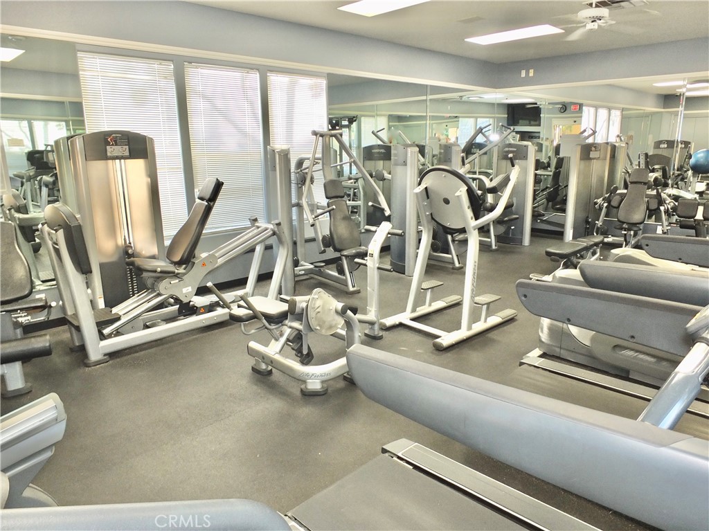 19431 Rue De Valore, Unit 19B Lake Forest, CA 92610 - Photo 15 of 24 a view of a room with gym equipment
