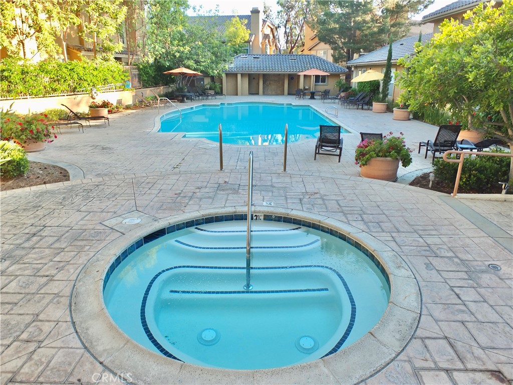19431 Rue De Valore, Unit 19B Lake Forest, CA 92610 - Photo 17 of 24 a view of a swimming pool with a patio