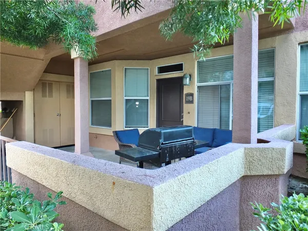 a living room with a couch and trees