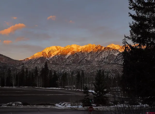 a living room with furniture fireplace and a flat screen tv