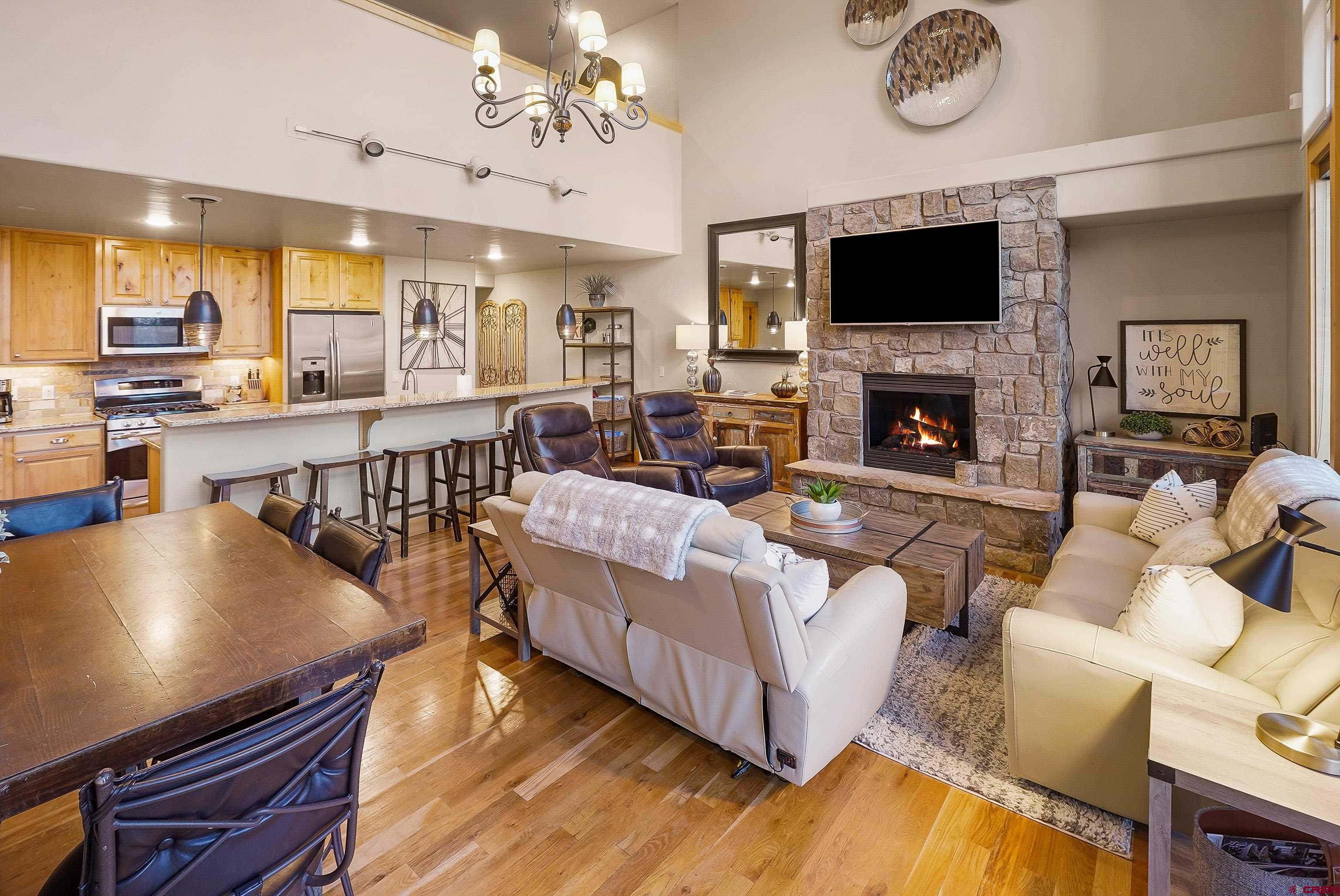 8 Summer Solstice Street Durango, CO 81301 - Photo 13 of 45 a living room with furniture fireplace and a flat screen tv