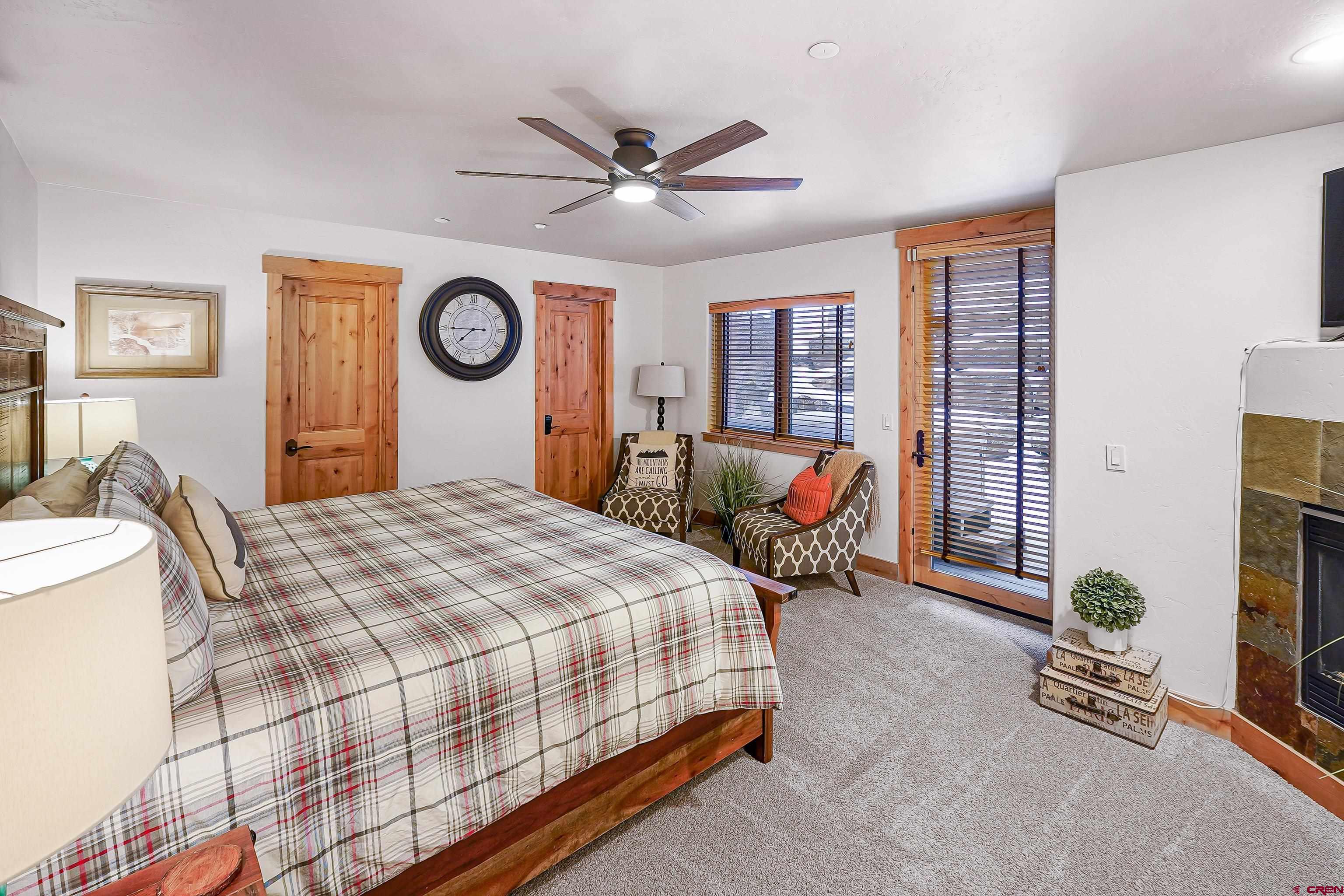8 Summer Solstice Street Durango, CO 81301 - Photo 14 of 45 a bedroom with a bed and a chandelier