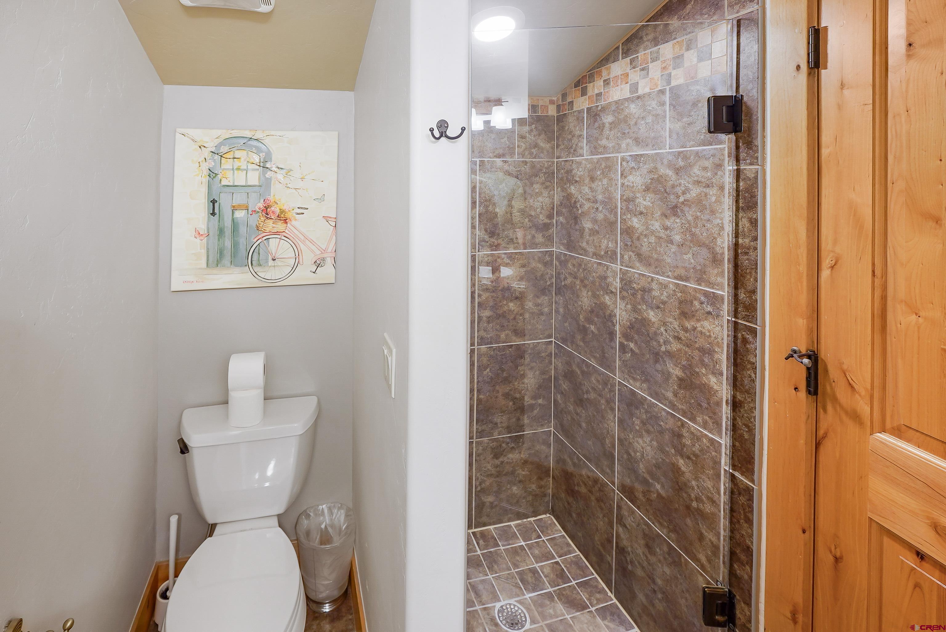 8 Summer Solstice Street Durango, CO 81301 - Photo 24 of 45 a bathroom with a toilet and a shower