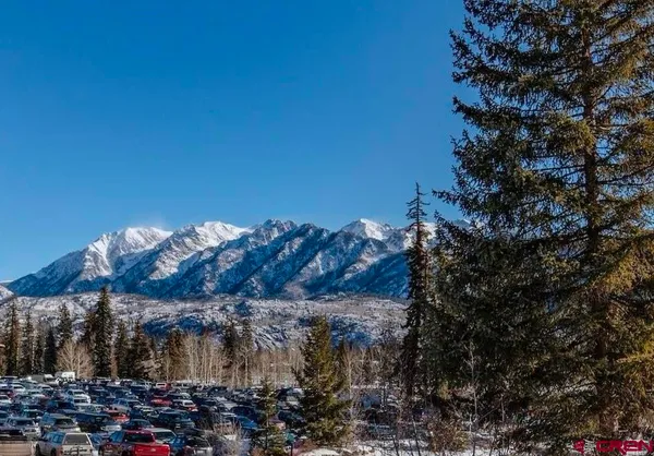 a kitchen with stainless steel appliances granite countertop a sink and a wooden cabinets