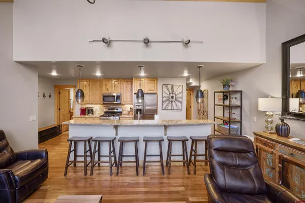 a living room with fireplace furniture and a flat screen tv