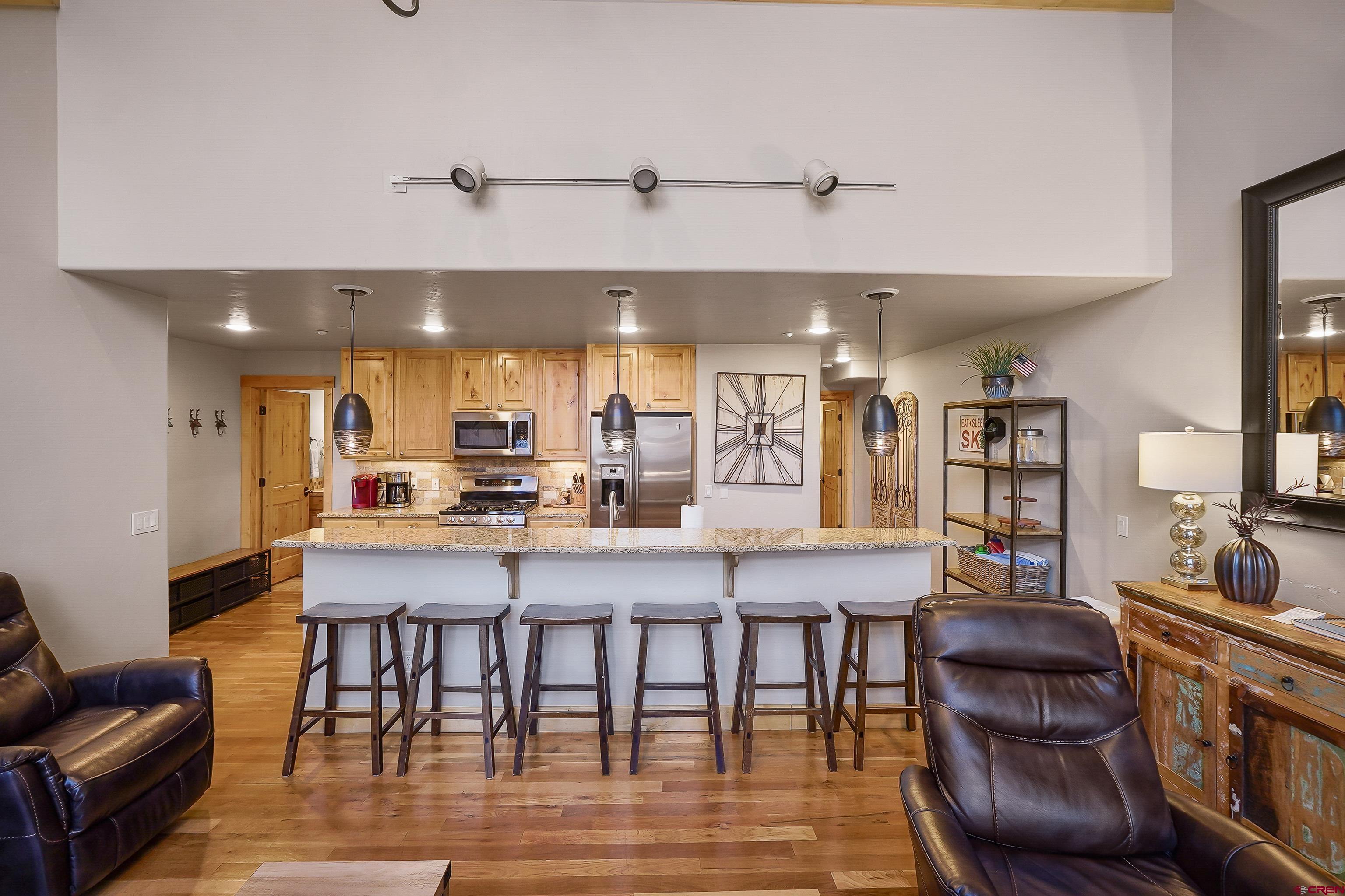 8 Summer Solstice Street Durango, CO 81301 - Photo 6 of 45 a dining room with furniture and wooden floor