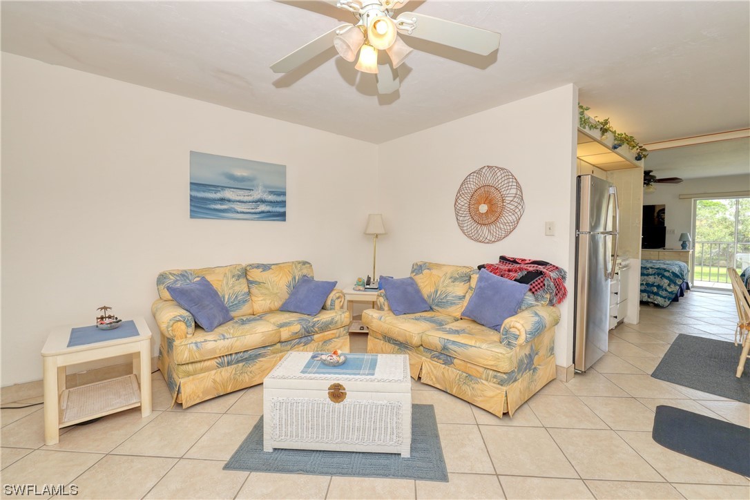 8109 Country Road, Unit 202 Fort Myers, FL 33919 - Photo 8 of 29 a living room with furniture and a table