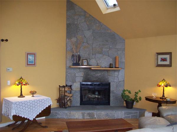 99 Westbrook Road Whately, MA 01373 - Photo 21 of 29 a living room with furniture and a fireplace
