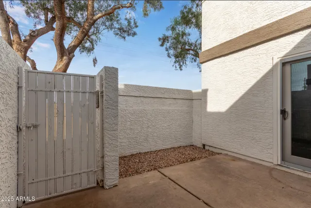 a view of a backyard with sitting area