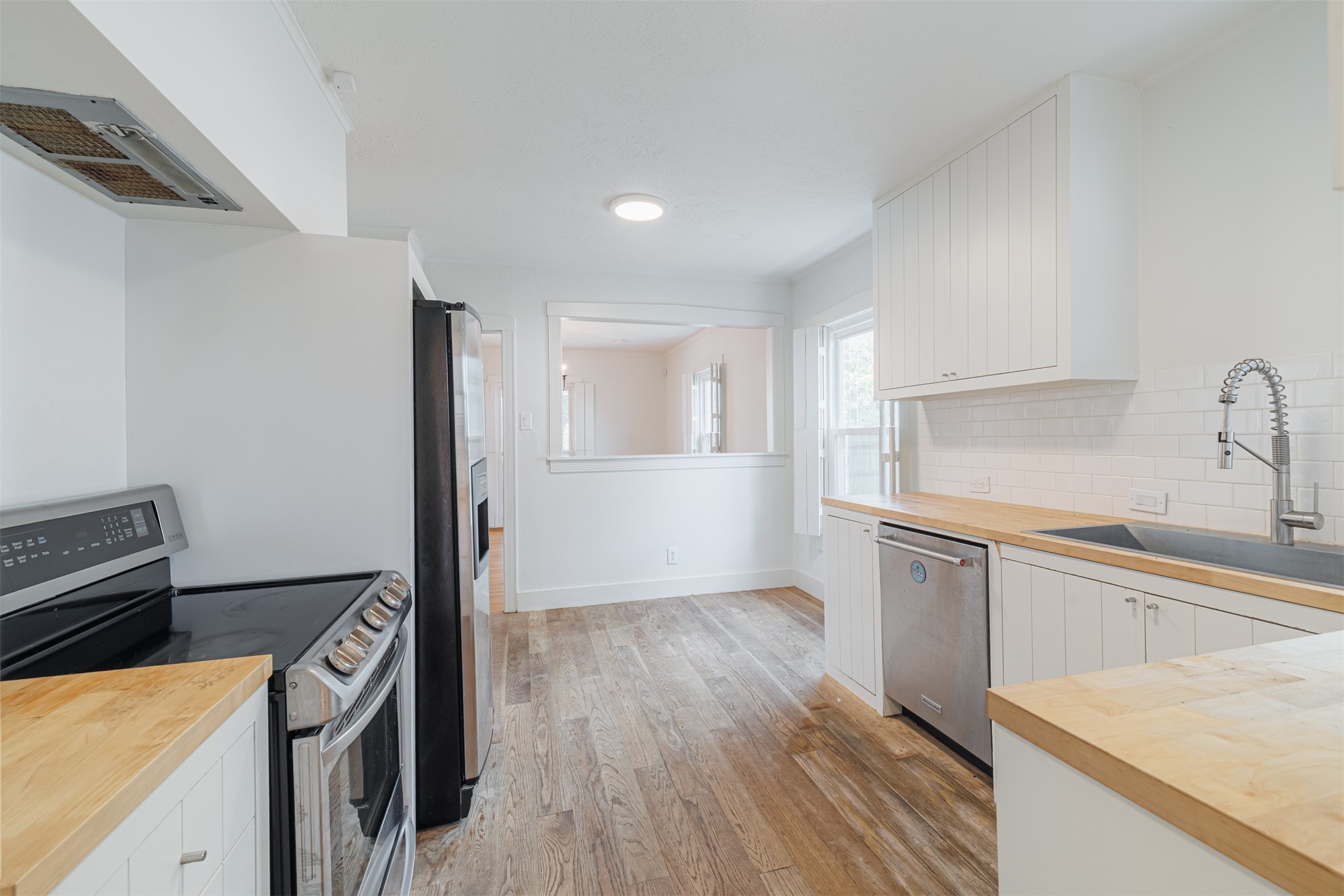 2438 Albans Road Houston, TX 77005 - Photo 17 of 35 Updated kitchen with stainless steel appliances and farm sink
