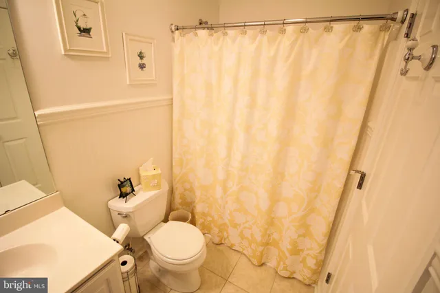 a kitchen with stainless steel appliances granite countertop a sink a stove and a wooden floors