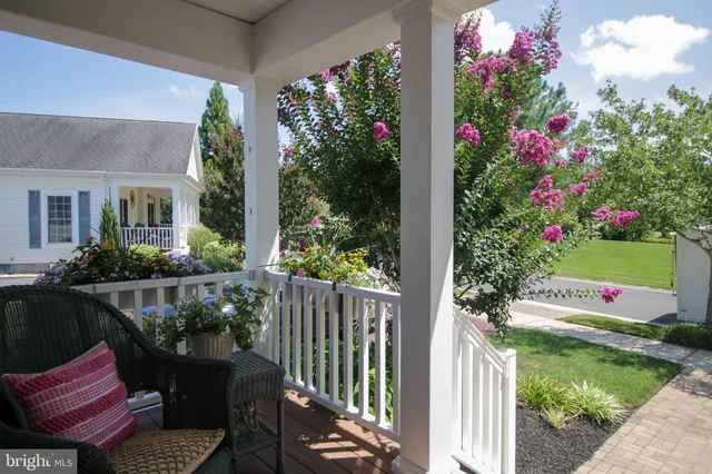 a view of a house with backyard sitting area and garden