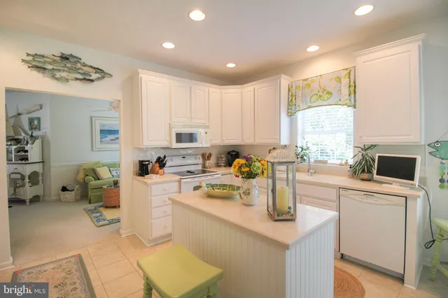 a view of a livingroom with furniture and a potted plant