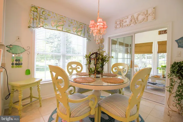 a bedroom with a bed couch and window