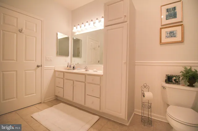 a view of patio with dining table and chairs under an umbrella