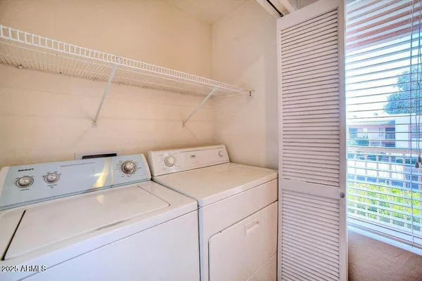 a utility room with dryer and washer