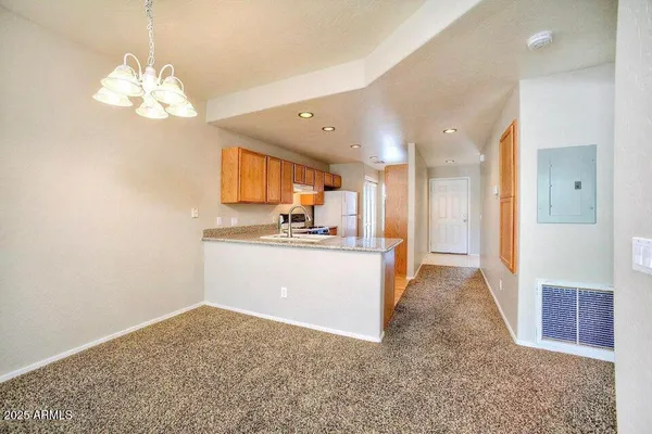 a view of a kitchen and a window
