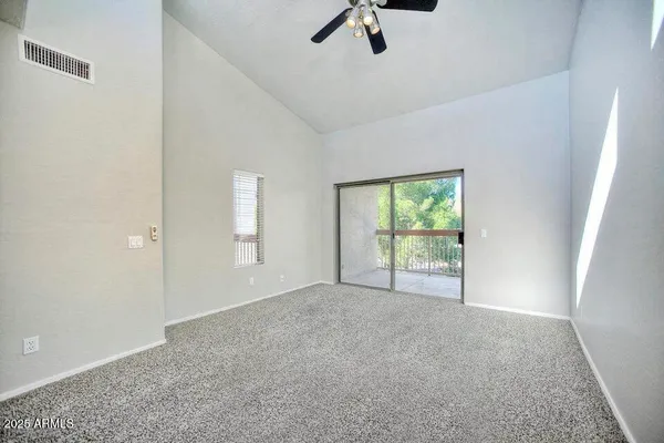 a view of an empty room with a window