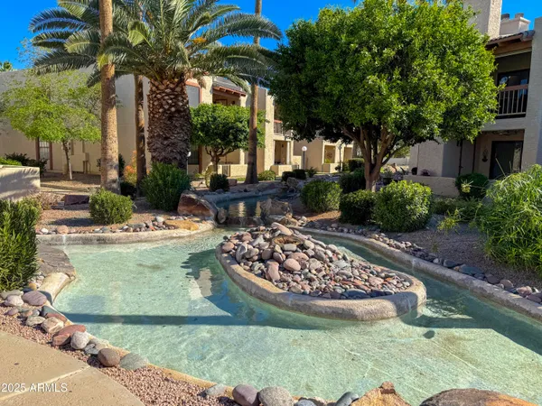 a view of a swimming pool with a patio