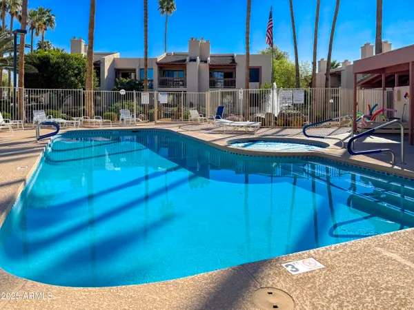 a view of a backyard with sitting area