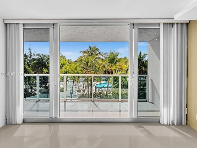 a view of a glass door with a balcony