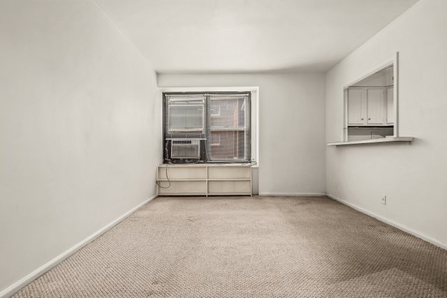 6118 North Sheridan Road, Unit 206 Chicago, IL 60660 - Photo 3 of 18 a view of an empty room with a window