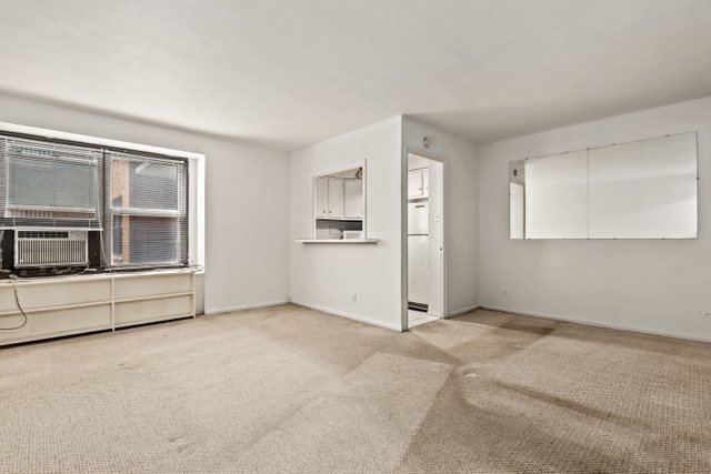 6118 North Sheridan Road, Unit 206 Chicago, IL 60660 - Photo 4 of 18 a view of empty room with window and refrigerator