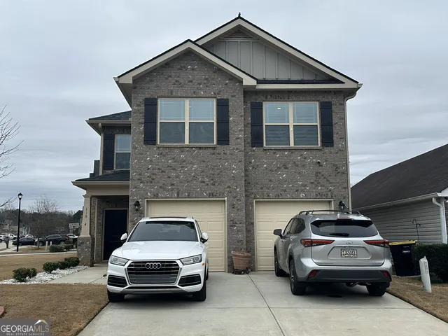 a view of a car in front of a house