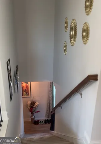 a bedroom with a bed and a flat tv screen