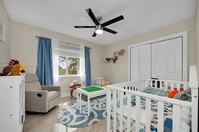 a bedroom with furniture and a book shelf