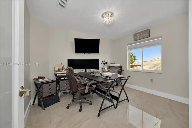 a view of a workspace with furniture