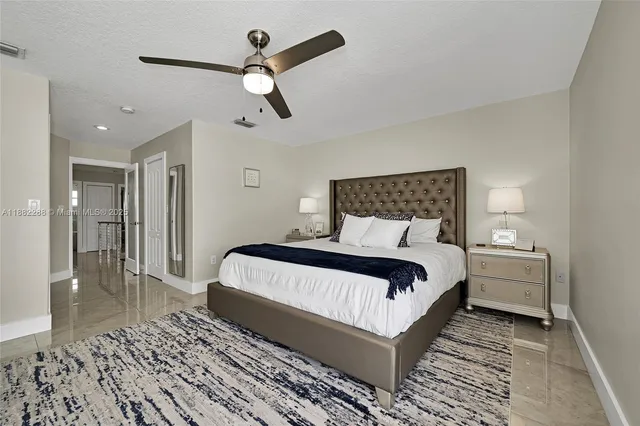 a spacious bathroom with double vanity sinks a mirror and a next to a window