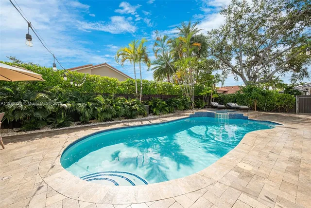 a view of a house with swimming pool