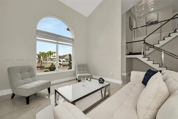 a living room with furniture and a table