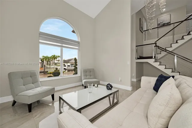 a living room with furniture and a table