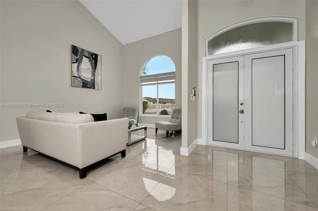 a living room with furniture and a window