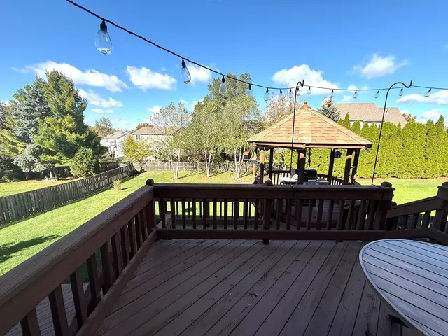 a view of a wooden deck with furniture