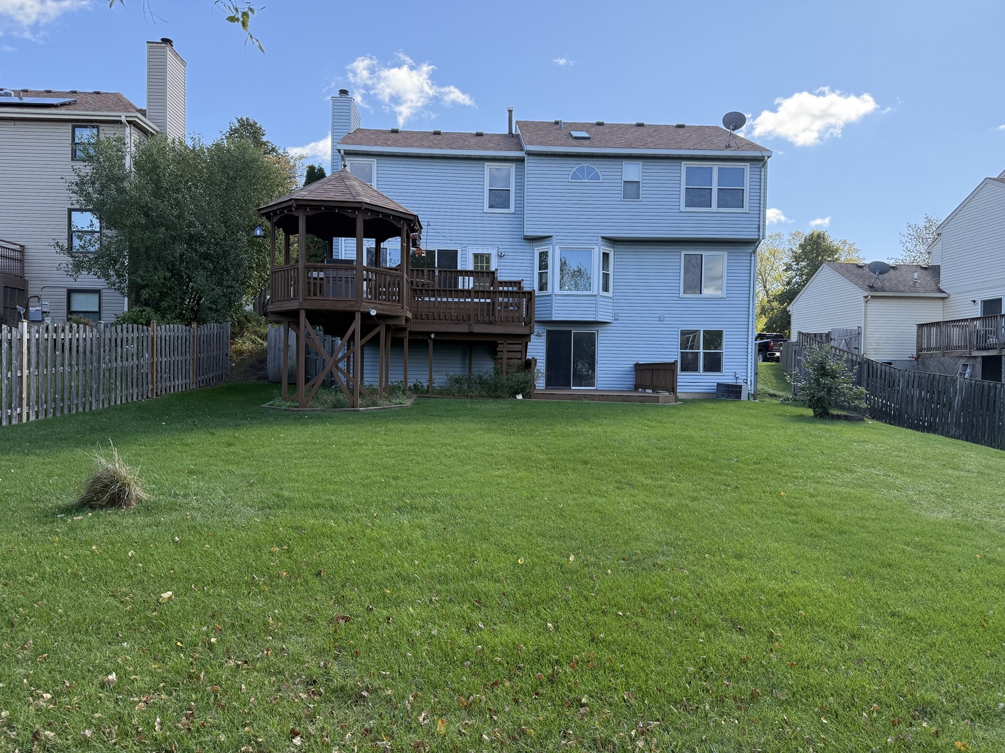 721 Mohican Trail Lake In The Hills, IL 60156 - Photo 20 of 20 a view of a house with a backyard and a patio