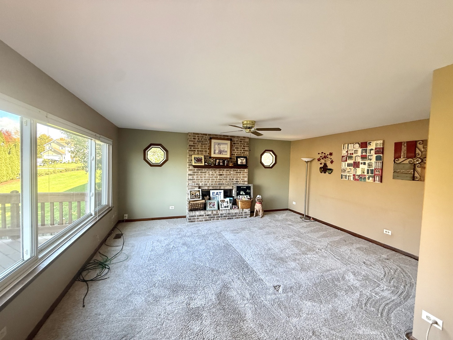 721 Mohican Trail Lake In The Hills, IL 60156 - Photo 2 of 20 an empty room with windows and painted walls